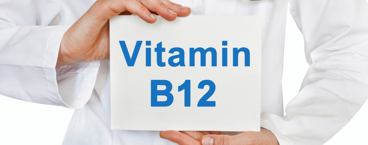 Person holding sign saying Vitamin B12