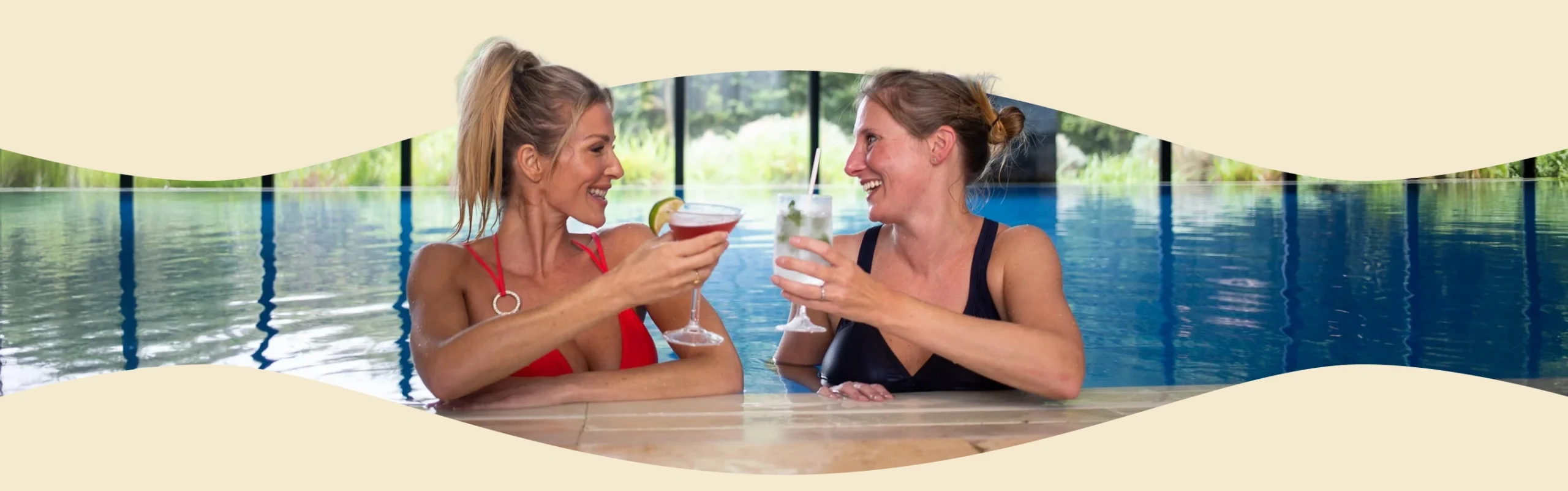 Spa image of members drinking cocktails in pool